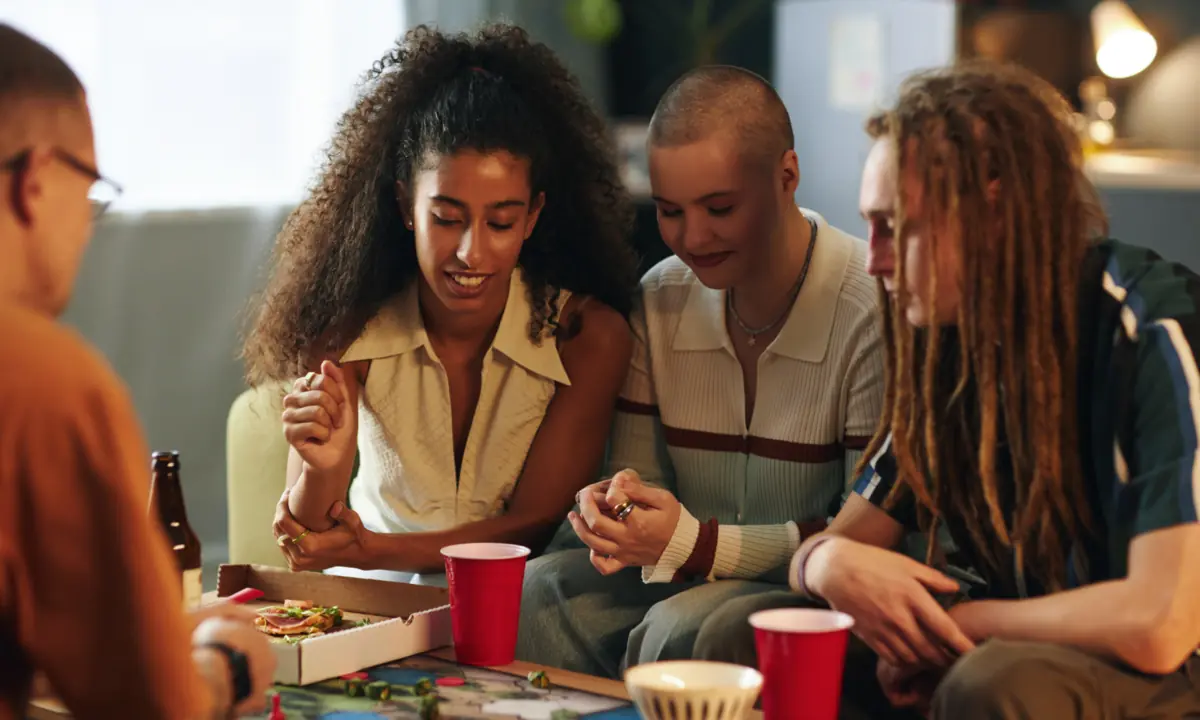 Neighbors gathered around a table for a casual game night.