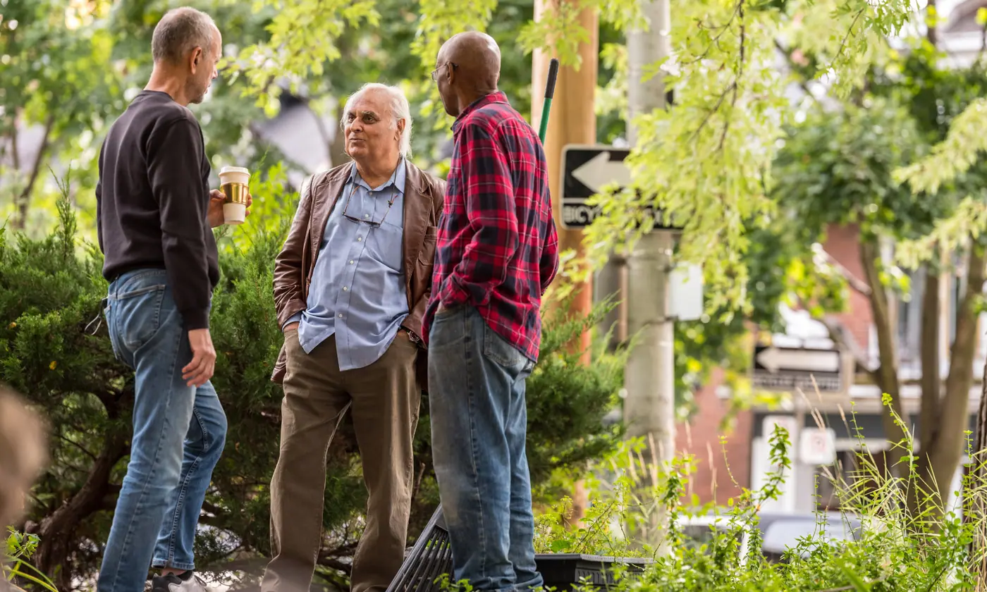Neighbors talking together outdoors