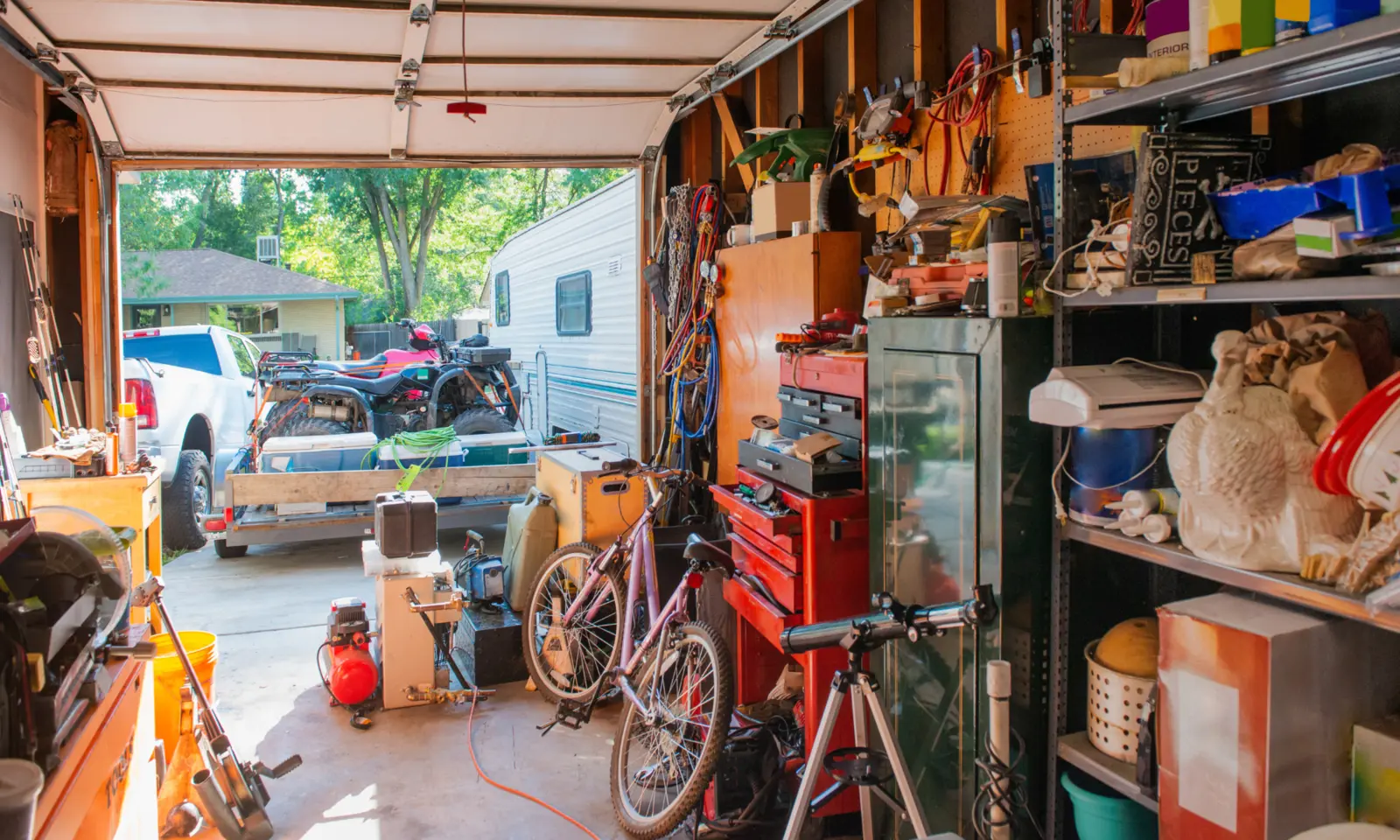 Tools and equipment in a neighbor’s open garage